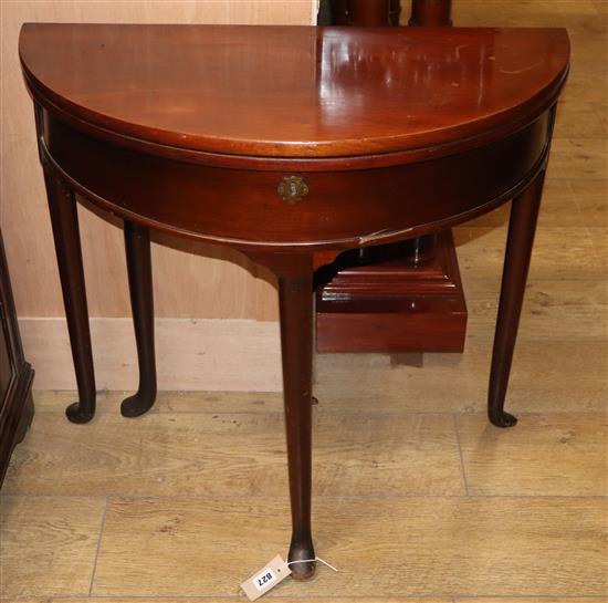 A George I style mahogany D-shaped folding card table W.74cm